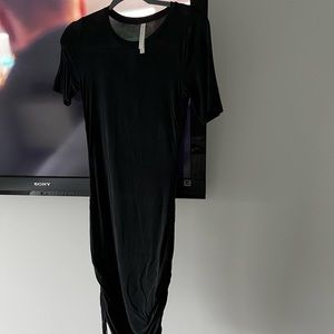 New black babaton dress xs with ruching on the sides